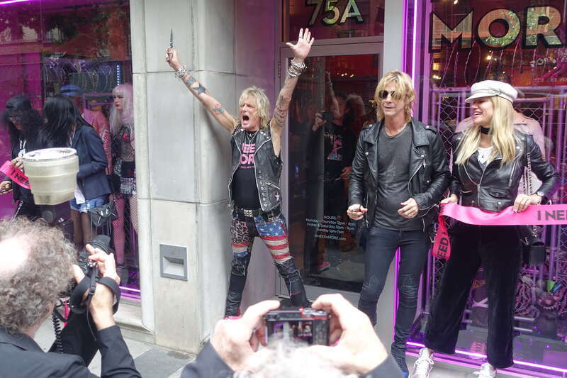 Jimmy Webb (pictured center) cutting the ribbon to open I NEED MORE alongside Slash and Duff from Guns N' Roses.