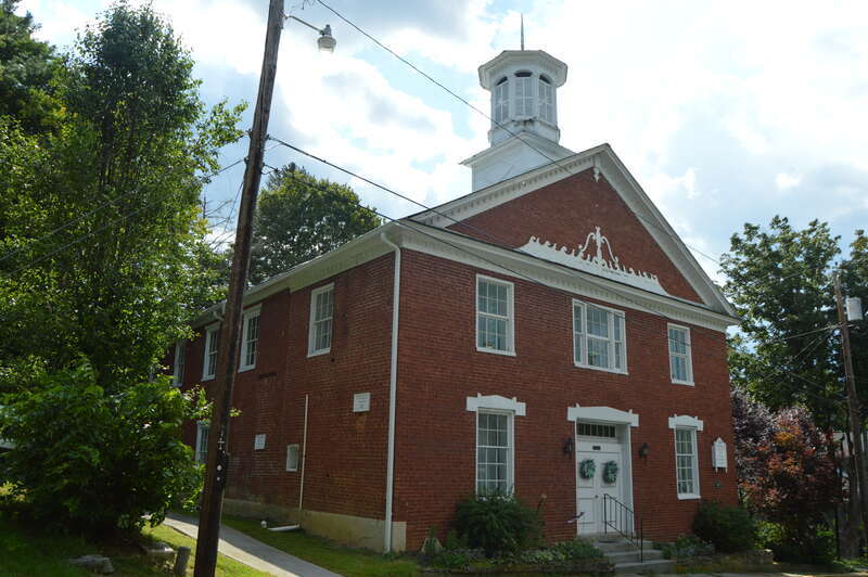 Front and eastern side of the John Wesley Methodist Church, located on the southern side of Foster Street east of the Lafayette Street intersection in Lewisburg, West Virginia, United States.  Built in 1820, it is listed on the National Register of