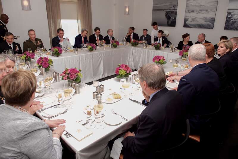 U.S. Secretary of State John Kerry sits with U.S. Defense Secretary Ash Carter, their Australian counterparts - Foreign Minister Julie Bishop and Defense Minister Marise Payne - and their respective aides during a working lunch at Ostra Restaurant in