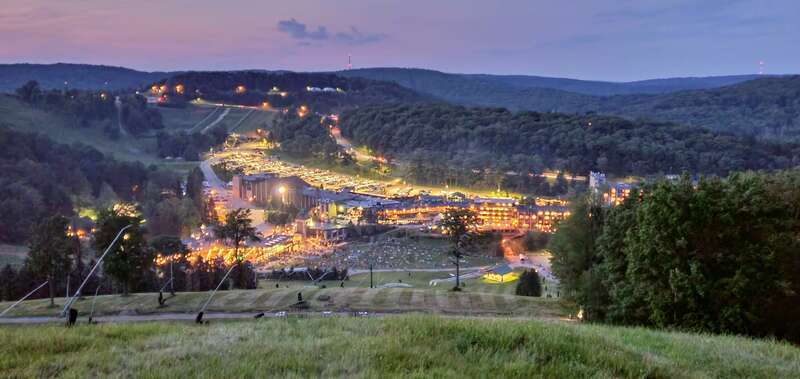 Seven Springs Mountain Resort viewed from the summit at dusk before the 4th of July fireworks.  The main hotel is at the bottom of the mountain with the Cortina chairlift nearby.