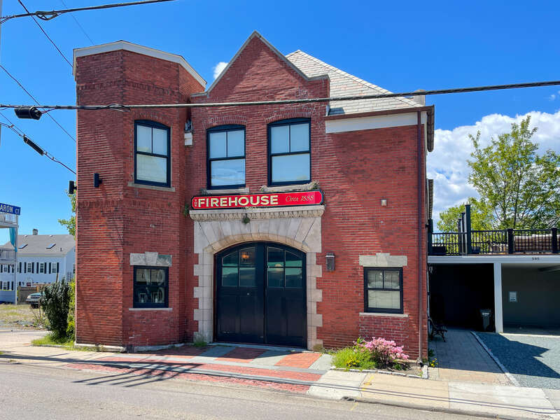 The Firehouse, 595 Thames Street, Newport, Rhode Island. Former firehouse built &quot;around 1888.&quot; Originally had a lookout tower. Later converted into a pizzeria and in 2017 was renovated into a vacation rental property.