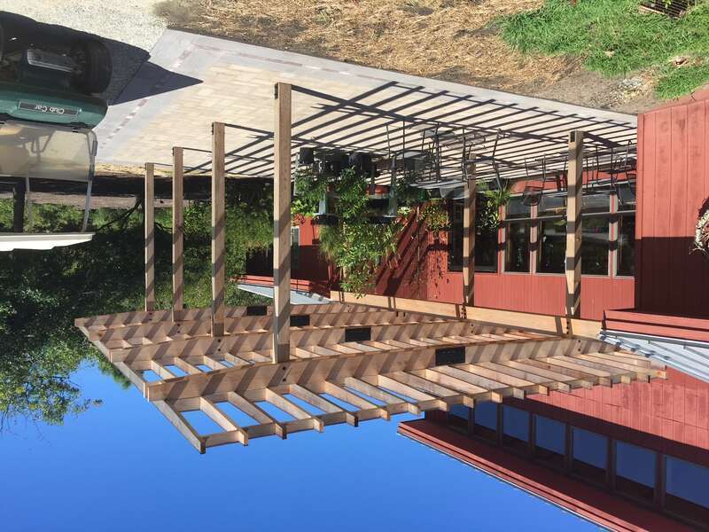 A view of the rear of the Visitors Center, following construction of the new pergola