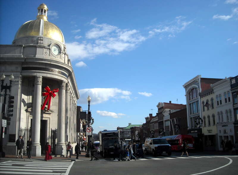 Facing east on M Street, N.W. (at the intersection of M Street and Wisconsin Avenue), in the Georgetown neighborhood of Washington, D.C.

The landmark, former headquarters of Farmers and Mechanics National Bank (left), located at 1201 Wisconsin
