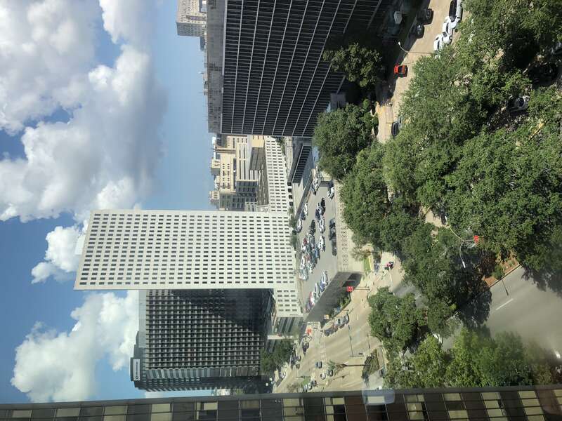 Aerial view over the Poydras Street / Loyola Avenue intersection in downtown New Orleans, Louisiana.  New Orleans City Hall to the right.