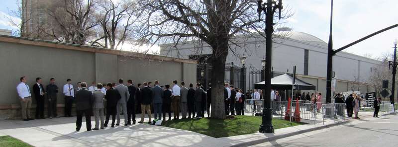 Outside Temple Square, near the end of the Saturday Afternoon Session of General Conference. On the left, a choir of Mormon teenagers sang hymns, next to the anti-Mormon protesters on the right.