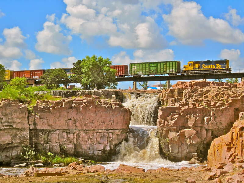 Photo edited picture of a train crossing over Sioux Falls in South Dakota