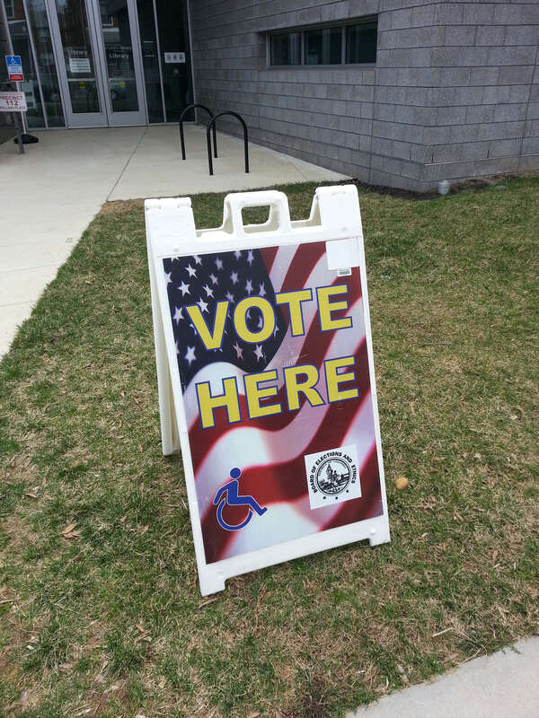 U Place SE entrance to the Anacostia Branch of the D.C. Public Library on primary election day, April 1, 2014.  The sign helps voters know where to vote!