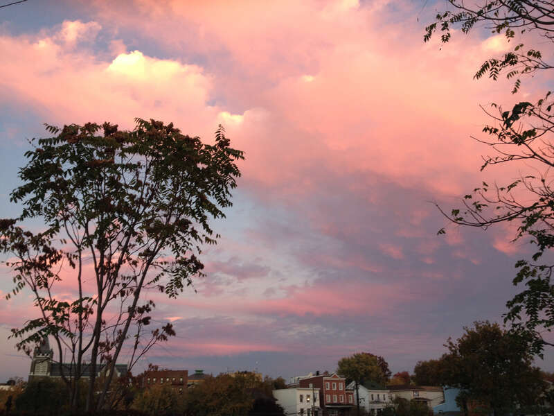 Cloud formations reflecting the sunset after a partly raining partly sunny day, taken while facing east in the parking lot of the American Self-Storage facility at 190 Baldwin Avenue in Jersey City, New Jersey.

This photo was created by Luigi Novi.