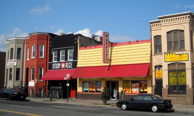 A Popeyes Chicken &amp;amp; Biscuits restaurant, Sticky Rice sushi restaurant, and other commercial properties located on the 1200 block of H Street, N.E., (north side) in the Near Northeast neighborhood of Washington, D.C.  The row houses visible on the