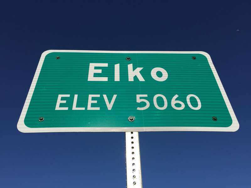 Entering &quot;Elko, 5060&quot; feet above sea level sign on Idaho Street (Nevada State Route 535 and Interstate 80 Business) in Elko, Nevada
