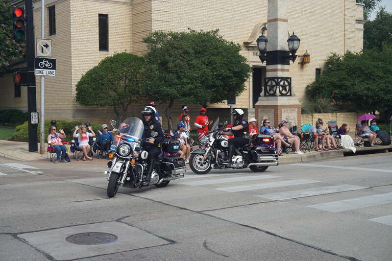 The DFW Airport Police motorcycles in the 2021 Arlington Independence Day Parade in Arlington, Texas (United States).