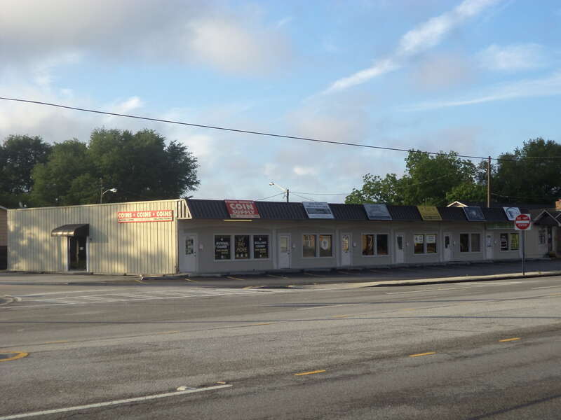 From left to right, the occupants are South Georgia Coin &amp;amp; Supply, Union Holiness Church of God in Christ, Trinity Barber &amp;amp; Beauty Shop, Black Sunshine Games, House of Joy (church), Mr. Fixit (phone repair), 3323 Bemiss Rd, Valdosta, Lowndes