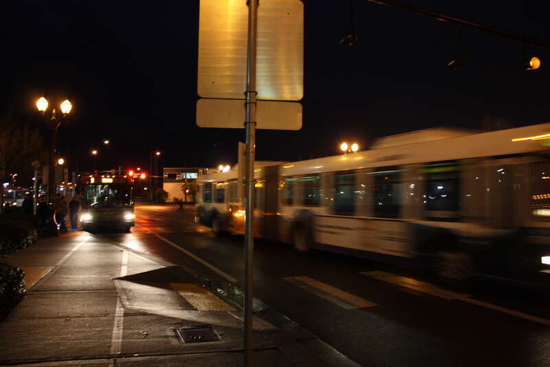 The outbound Sound Transit Express route 510 departs and the Everett Transit route 9 northbound continues boarding passengers.