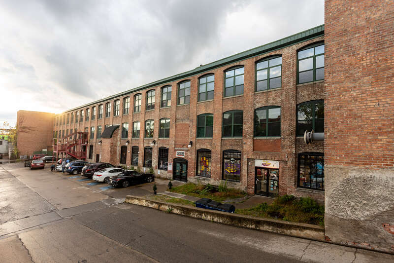 Amphion Piano Player Factory, parking lot and south facade. Syracuse New York
