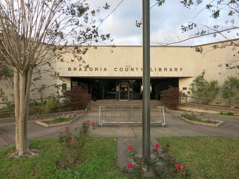 Photo shows the Brazoria County Library at 401 E. Cedar Street, Angleton, Texas 77515. View is toward the northeast.