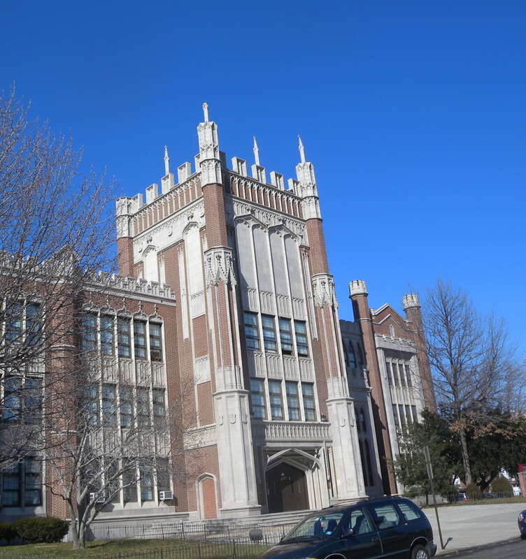 Looking northwest across Avenue A at northern tower on a sunny midday.  Oh, but is this the JHS?