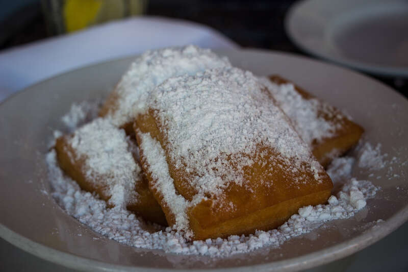 Because you can't eat here without having these, we split an order for dessert at Ralph Brennan's Jazz Kitchen: Beignets - A New Orleans classic! French donuts topped with powdered sugar.