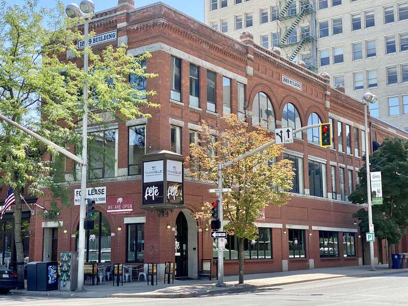 Built in 1889, this Romanesque Revival-style building was originally known as the Bodie Block, and housed apartments on the upper floors, with retail space on the ground floor.  The building features a red brick exterior with decorative patterned