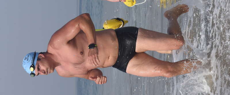 A man wearing a black Nike swim trunk exits the water after swimming the Second Annual Redondo Beach Open Water Swim held on Sunday, July 14, 2019.

VFJ_0308_cr