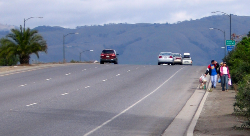 Capitol Expressway bridge over railroad and Monterey Road in San Jose, CA, USA. Family is using path approach to over-crossing.