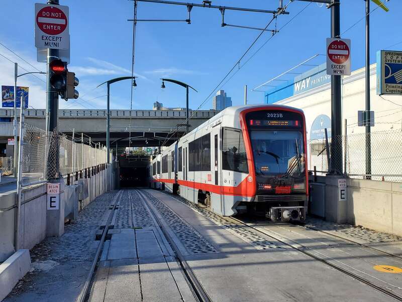 A northbound train entering the 4th Street portal in November 2022 on the first day of passenger operations in the Central Subway