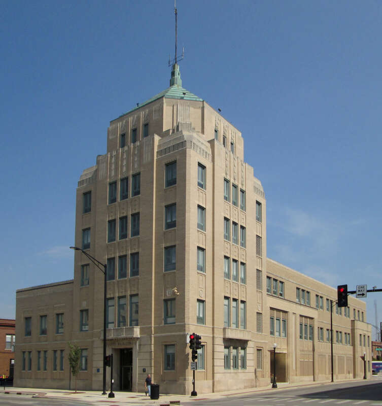 The City of Champaign's City Building, located at 102 N. Neil Street in Champaign, Illinois, was built in 1935–1937 and was designed by George Ramey in the Art Deco style. (Source: [1])