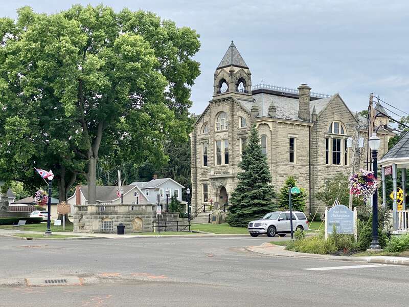 Built in 1884, this Queen Anne-style rusticated Amherst sandstone building was constructed to house the municipal government and municipal services for the city of Amherst.  The building sits on the Amherst town square in Downtown Amherst, with a