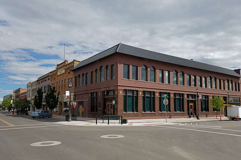 The corner of South Seventh Avenue and Main Street, looking southwest, showing the Commercial Building in Caldwell, Idaho, designed by Tourtellotte and Hummel and listed as site #2 in the Caldwell Historic District, NRHP. The 1906 construction