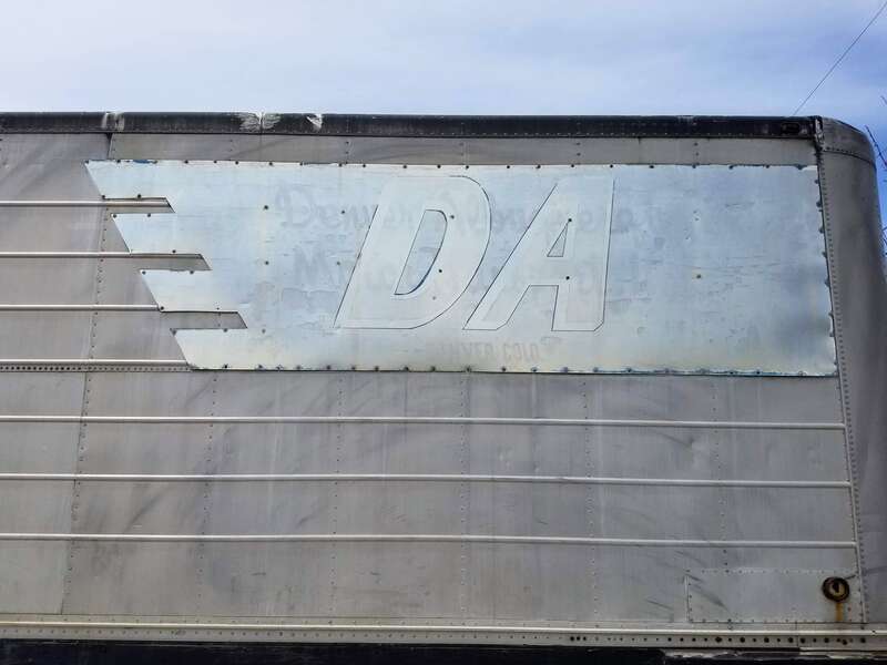 Sign on trailer, &quot;DA, Denver Albuquerque Motor Transport, Denver, Colo.&quot;, parked in Adams County, CO.