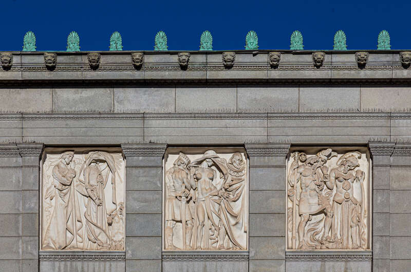 Deborah Cook Sayles Public Library. The six bas-reliefs above the library windows depict scenes from literature and mythology.
