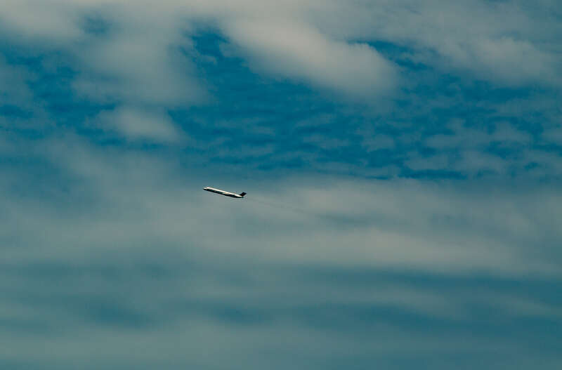 A Delta Air Lines plane taking off from Birmingham Airport (BHM) in Birmingham, Alabama, as seen from Railroad Park.