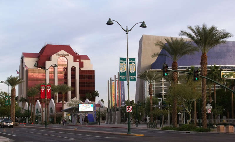 Photograph of downtown Mesa, Arizona, showing the Mesa Bank building and the Mesa Arts Center. This photo was taken in 2010, at the northwest corner of Main and Center Street, not long prior to the extension of the Valley Metro Rail line through the
