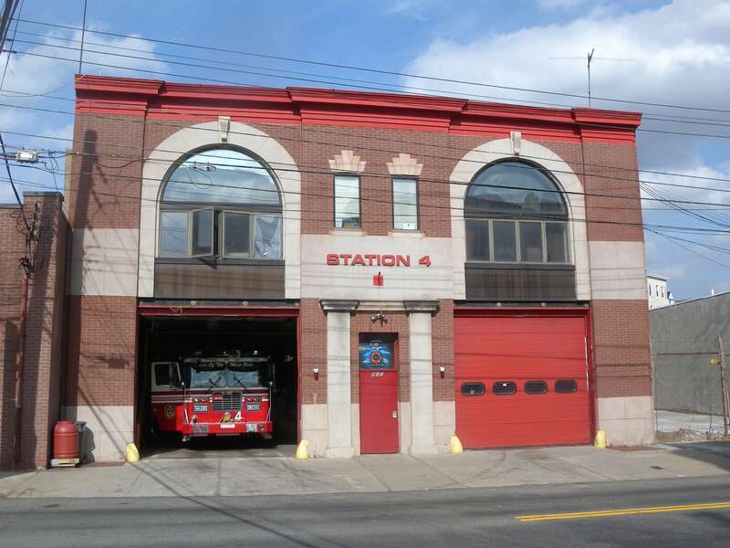 Looking north from Bleeker Street at Fire Station 4 on a mostly sunny early afternoon.