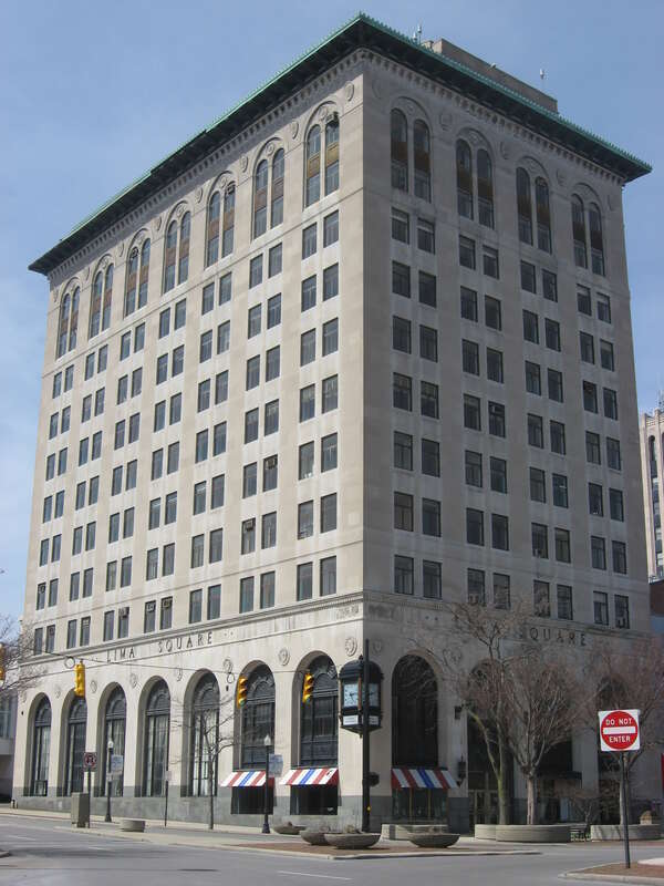 Closeup of the front and southern side of the First National Bank and Trust Building, located at 43-53 Public Square in downtown Lima, Ohio, United States.  Built in 1926, it is listed on the National Register of Historic Places.