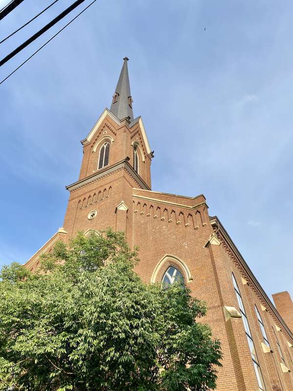 Built in 1874, this Gothic Revival-style building was designed by Cincinnatius Shryock for the congregation of the First Presbyterian Church of Lexington, founded as Mount Zion Church in 1784.  The building features a red brick exterior, a rough-hewn