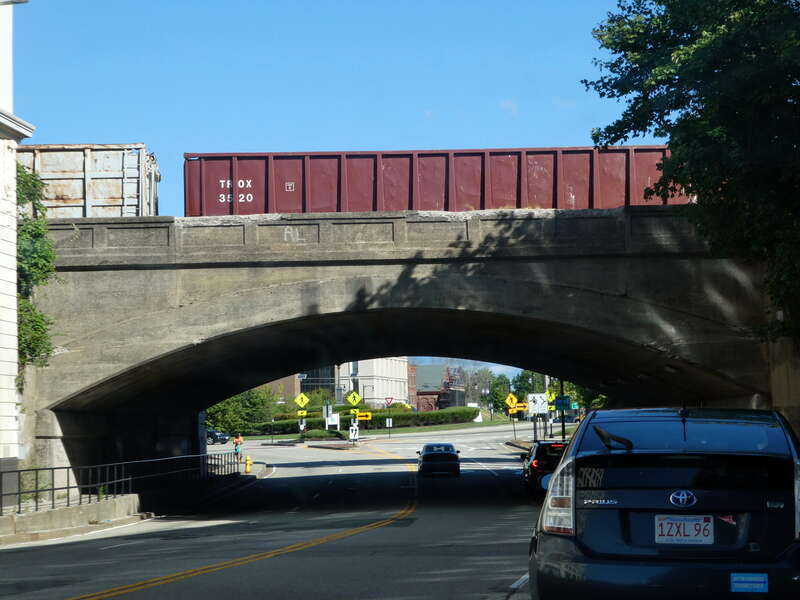 A CSX freight train on the Grafton Street bridge at Worcester Union Station in September 2022
