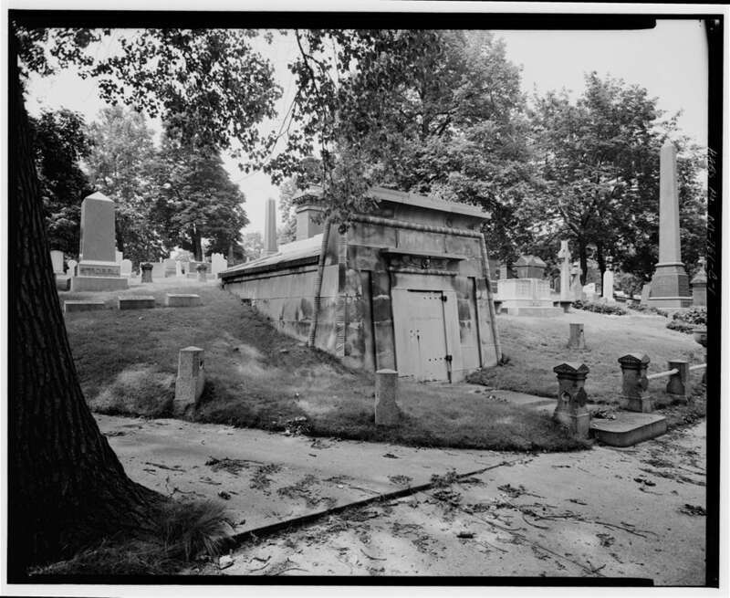 Photographic view of the tomb of New York mayor George Opdyke, showing main and side elevations, with Egyptian revival tomb situated within surrounding gravestones, Mount Pleasant Cemetery, 375 Broadway Street, Newark, Exeter County, New Jersey.