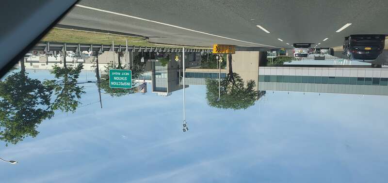 Traveling west through the former toll plaza towards the new Goethals Bridge, at Goethals Road North / Gulf Avenue west of Forest Avenue in Old Place / Arlington / Bloomfield, Staten Island. Pictured is the 1960s modernist overpass bridge leading to