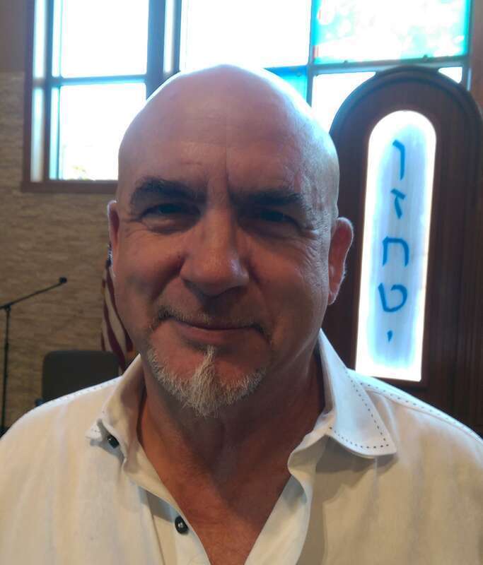 Glass artist Gordon Huether on November 15, 2014, at Congregation Beth Shalom in Napa, California, where several of his works are installed.