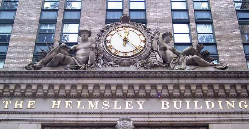Sculptures and clock over the entrance to the Helmsley Building.
