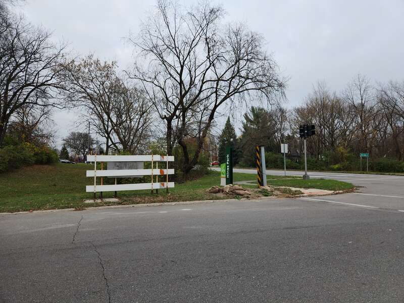 Intersection of Edward N. Hines Drive and Outer Drive in Dearborn Heights, Michigan, showing gates and barriers at the intersection that close Hines Park during flooding