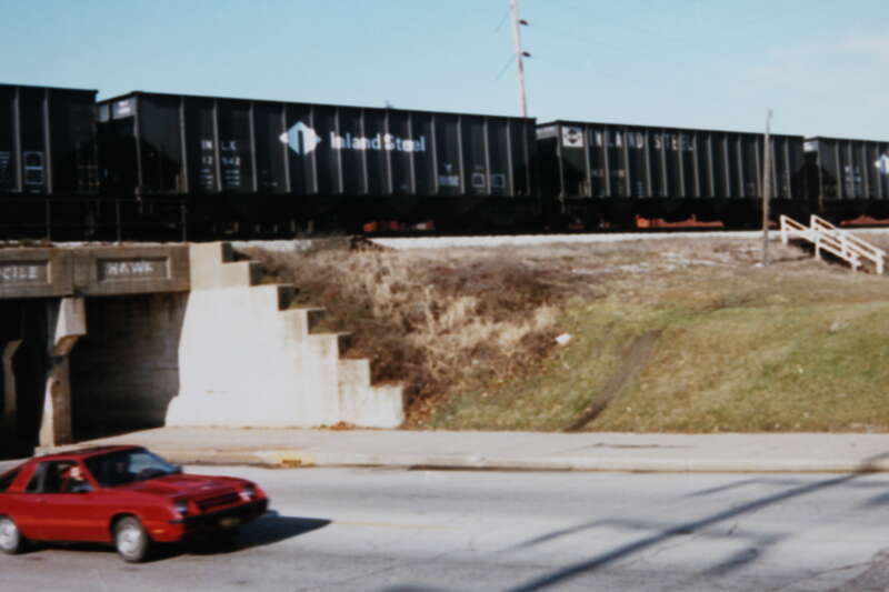 IC/ICG, Champaign, IL, Railroad rolling stock, 1986; digital copy of print. Complete indexed photo collection at WorldHistoryPics.com.