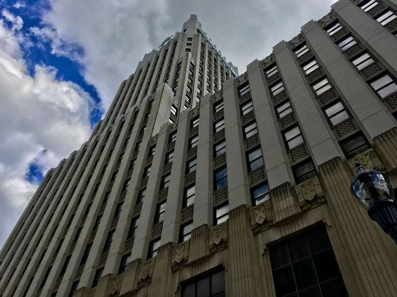 Looking upward at the Art Deco-style Huntington Tower fron West Mill Street, Akron, Ohio, May 2020.