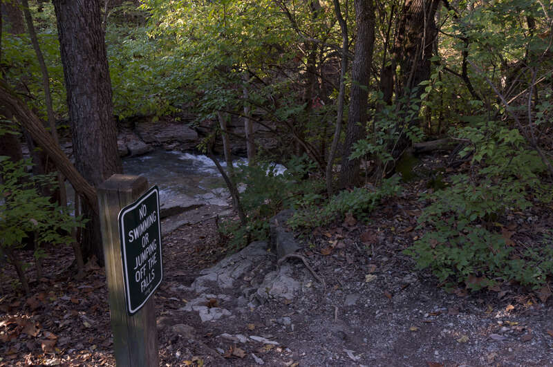 A sign at Indian Run Falls in Dublin, Ohio advising people foolish enough to jump into a Waterfall that natural selection doesn't discriminate.