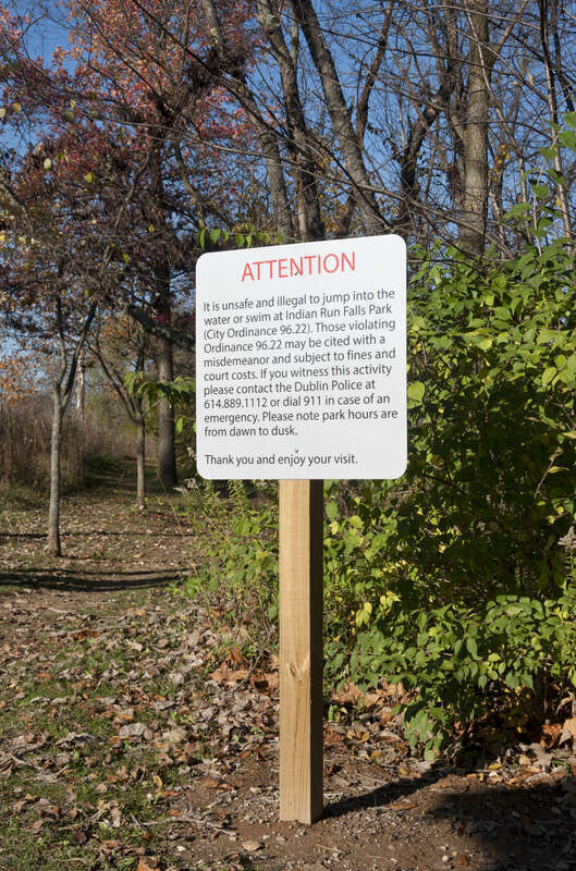 A sign at Indian Run Falls in Dublin, Ohio advising people foolish enough to jump into a Waterfall that natural selection doesn't discriminate.