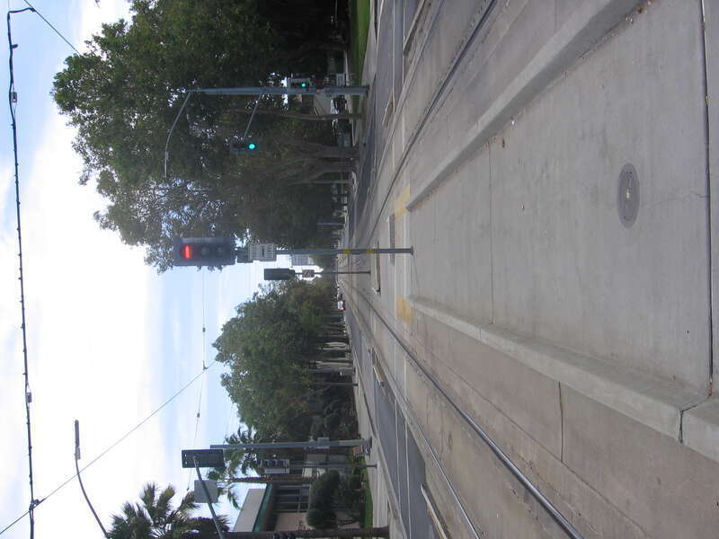 The Japantown–Ayer (VTA) light rail station in San José, California, USA.  In this view looking south from the station, the northern lip of the North First Street trench can be seen in the distance along the street past where the rail lines approach