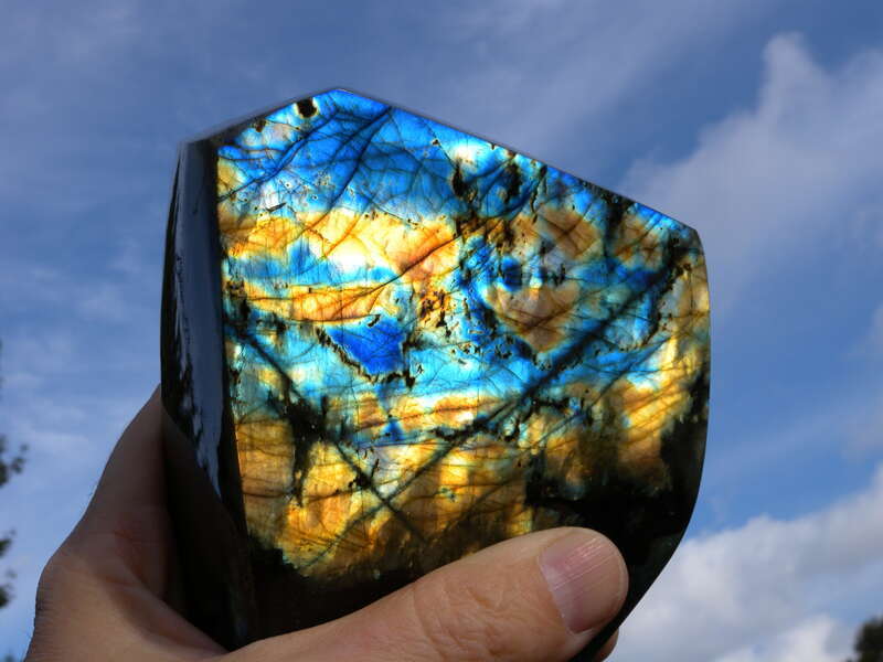 A feldspar mineral. The colors are called &quot;labradorescence&quot; or the &quot;schiller effect.&quot;