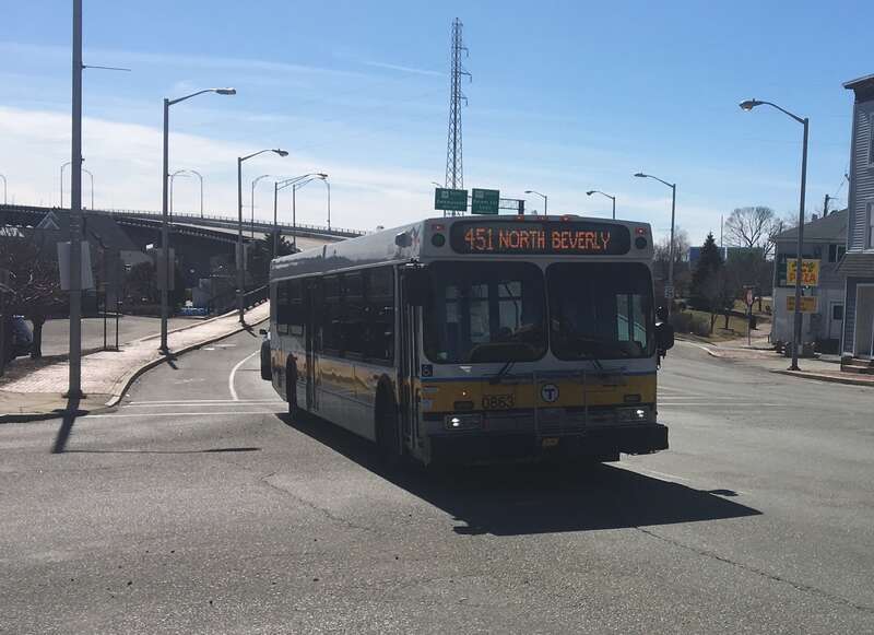 MBTA route 451 bus entering Beverly on the Veterans Memorial Bridge in March 2019