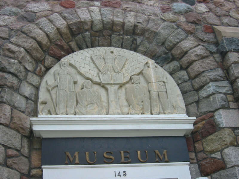 The former city hall building in Milaca, Minnesota.  It is now operated as a museum and is on the National Register of Historic Places.  Detail of the artwork above the door.