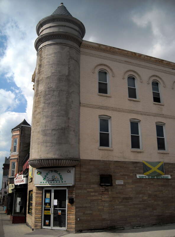 Naby's Island Restaurant (center), located at 1128 H Street, N.E., in the Near Northeast neighborhood of Washington, D.C.


Built in 1895, the brick, three-story, Queen Anne-style Jamaican restaurant features a prominent turret.  The building